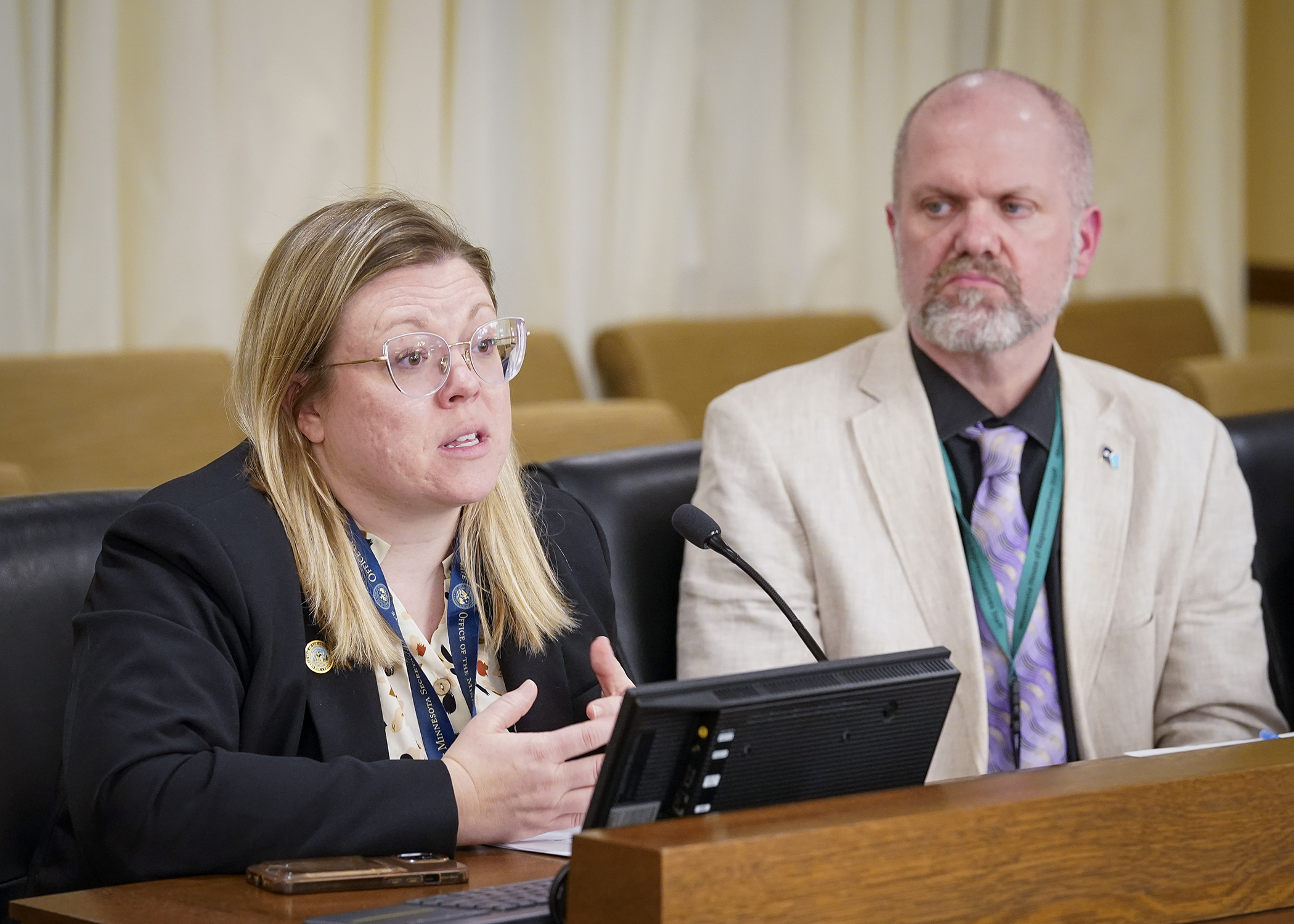 Nicole Freeman, government relations director for Secretary of State’s Office, answers a question during discussion of a bill to require the office to prepare a voter information guide prior to each statewide general election. (Photo by Andrew VonBank)